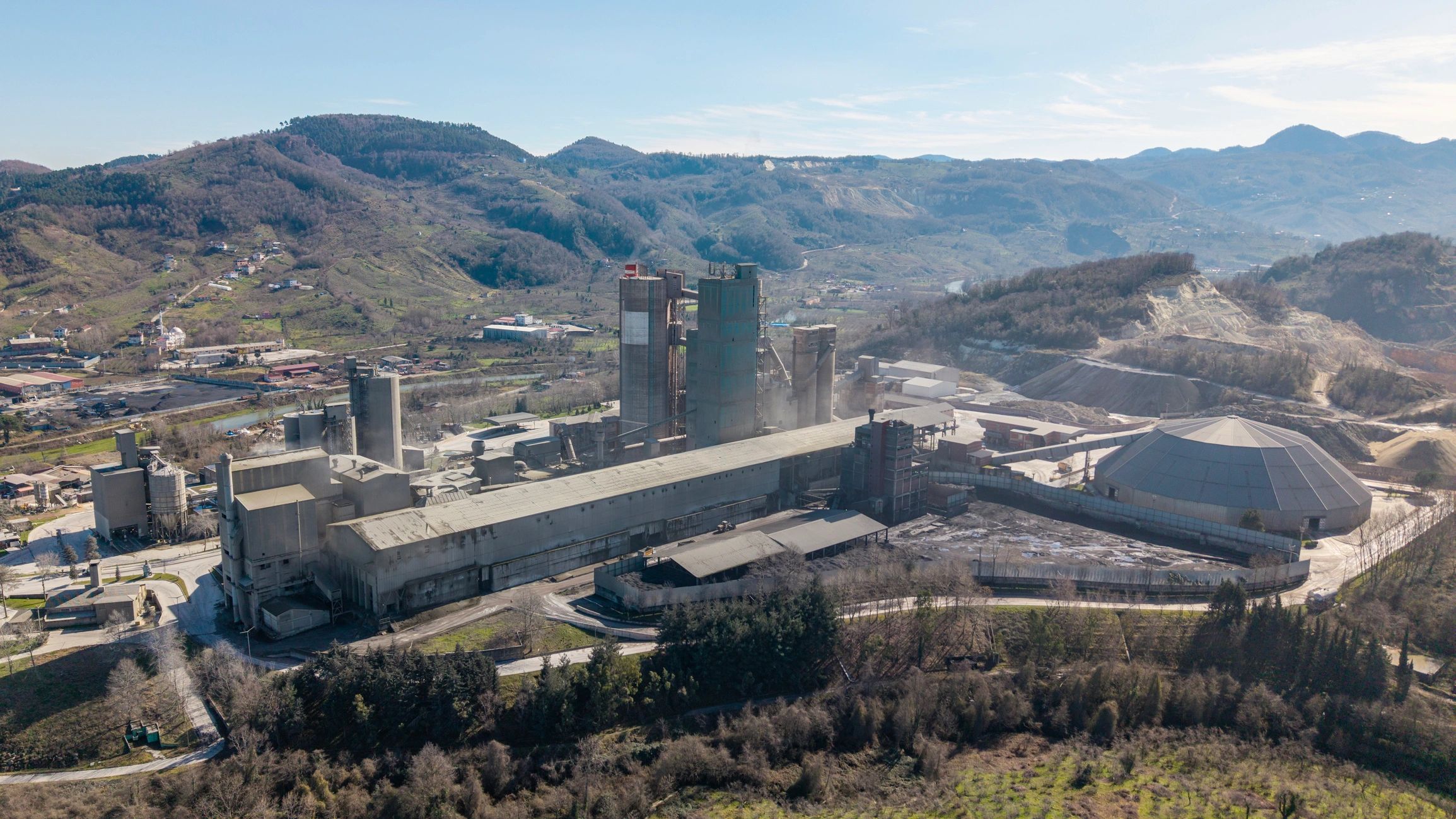 Industrial plant in a rural landscape representing energy-intensive development