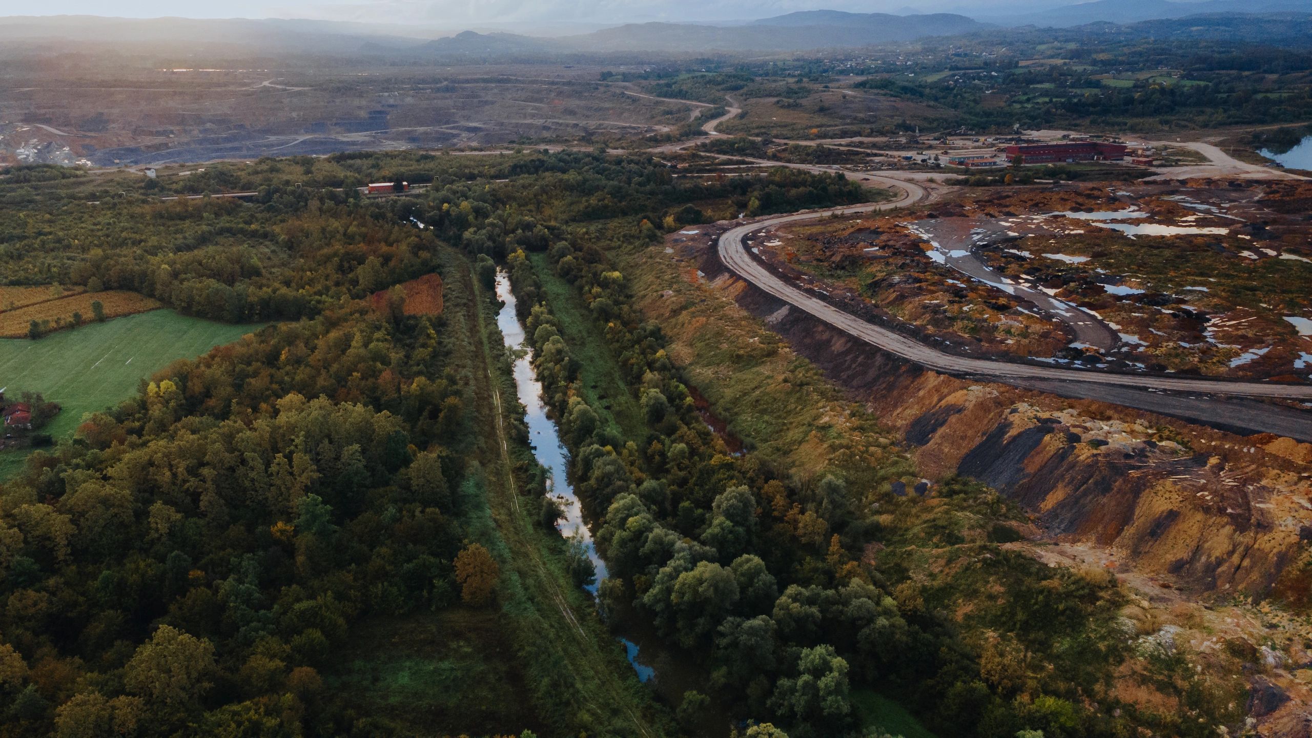 Aerial landscape showing industrial land and surrounding natural environment